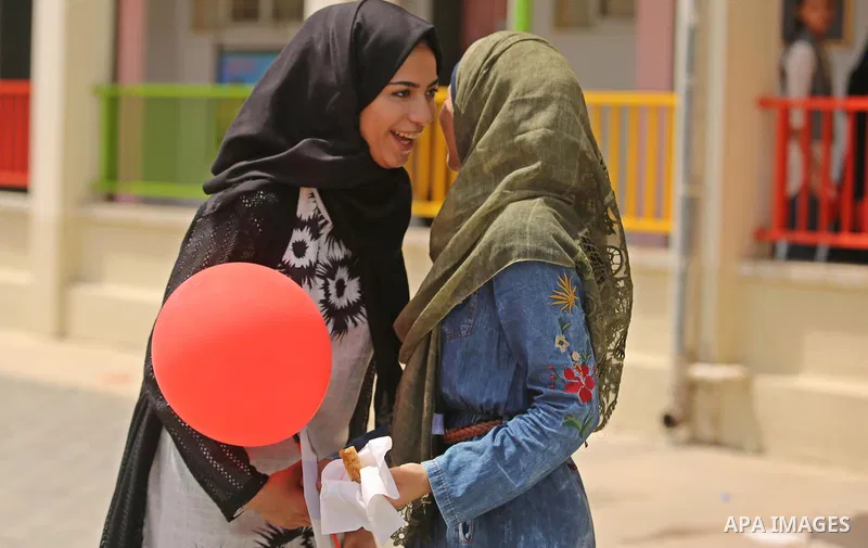 Palestinian high school female students celebrate after heard their results of final exams known as "Tawjihi", in Gaza city on July 12, 2017. Photo by Ashraf Amra
