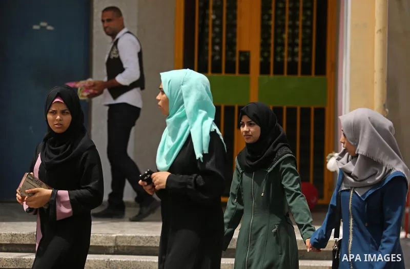 Palestinian high school female students celebrate after heard their results of final exams known as "Tawjihi", in Gaza city on July 12, 2017. Photo by Ashraf Amra