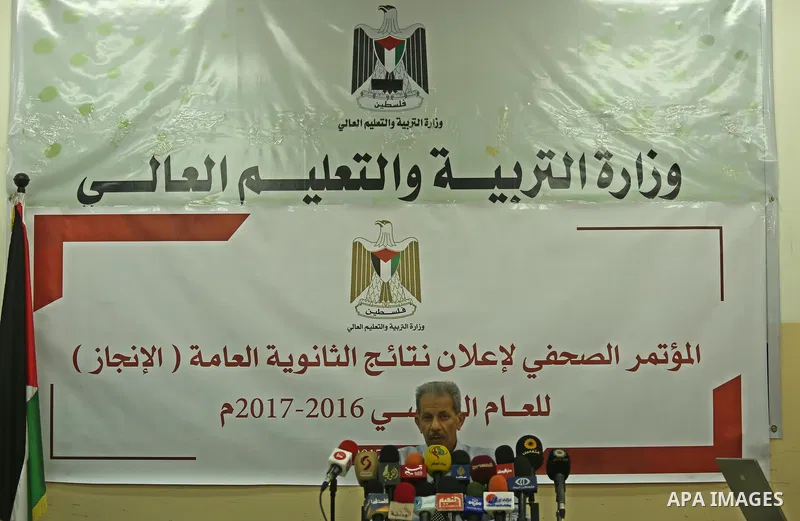 Director General of high school examinations in Gaza Strip, Marwan Sharaf, speaks during a press conference to announce the results of the final high school exams known as "Tawjihi"', in Gaza city on July 12, 2017. Photo...