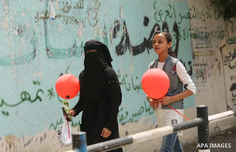 Palestinians celebrate after heard the results of final exams known as "Tawjihi", in Gaza city on July 12, 2017. Photo by Ashraf Amra