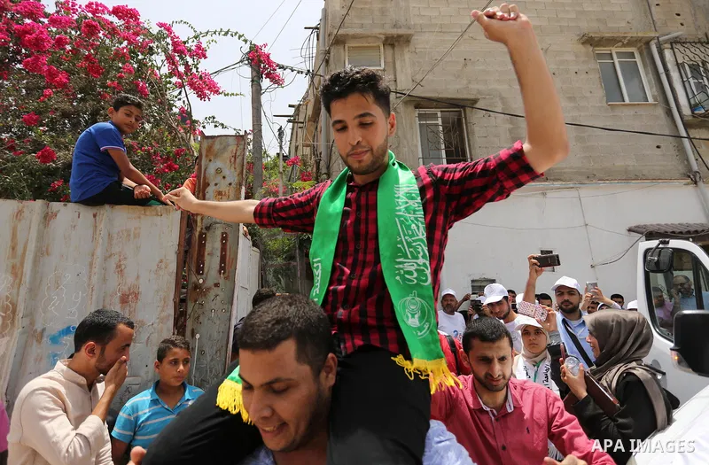A Palestinian high school student, Loa'y Qnoua 99.7, celebrates with his family after heard the results of his final exams known as ''Tawjihi'', in Gaza city on July 12, 2017. Photo by Ashraf Amra