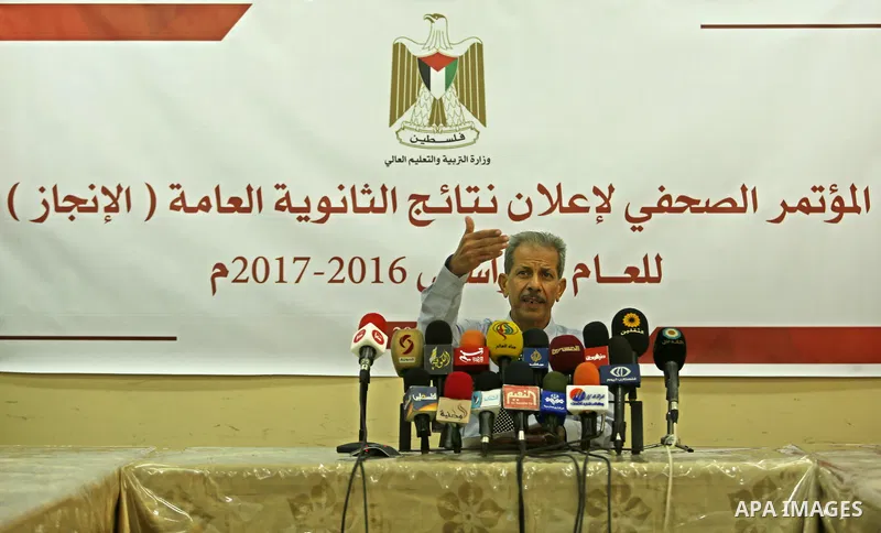 Director General of high school examinations in Gaza Strip, Marwan Sharaf, speaks during a press conference to announce the results of the final high school exams known as "Tawjihi"', in Gaza city on July 12, 2017. Photo...