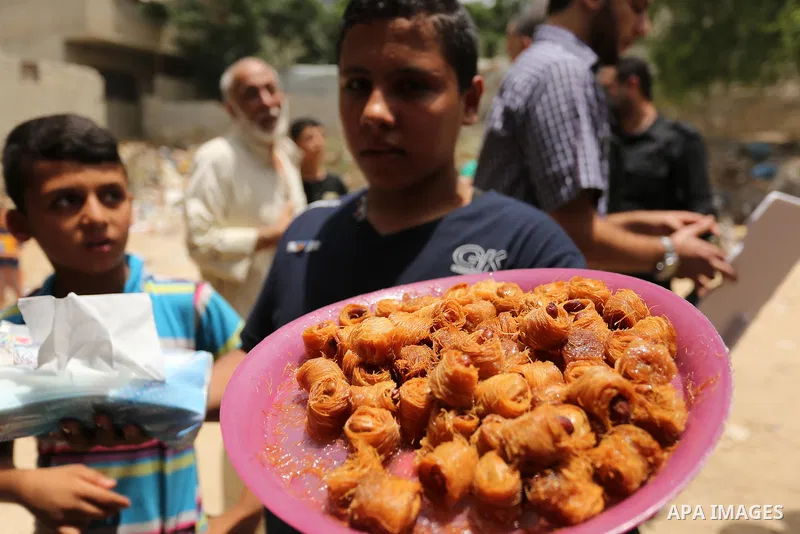 Palestinians celebrate after heard the results of final exams known as "Tawjihi", in Gaza city on July 12, 2017. Photo by Ashraf Amra