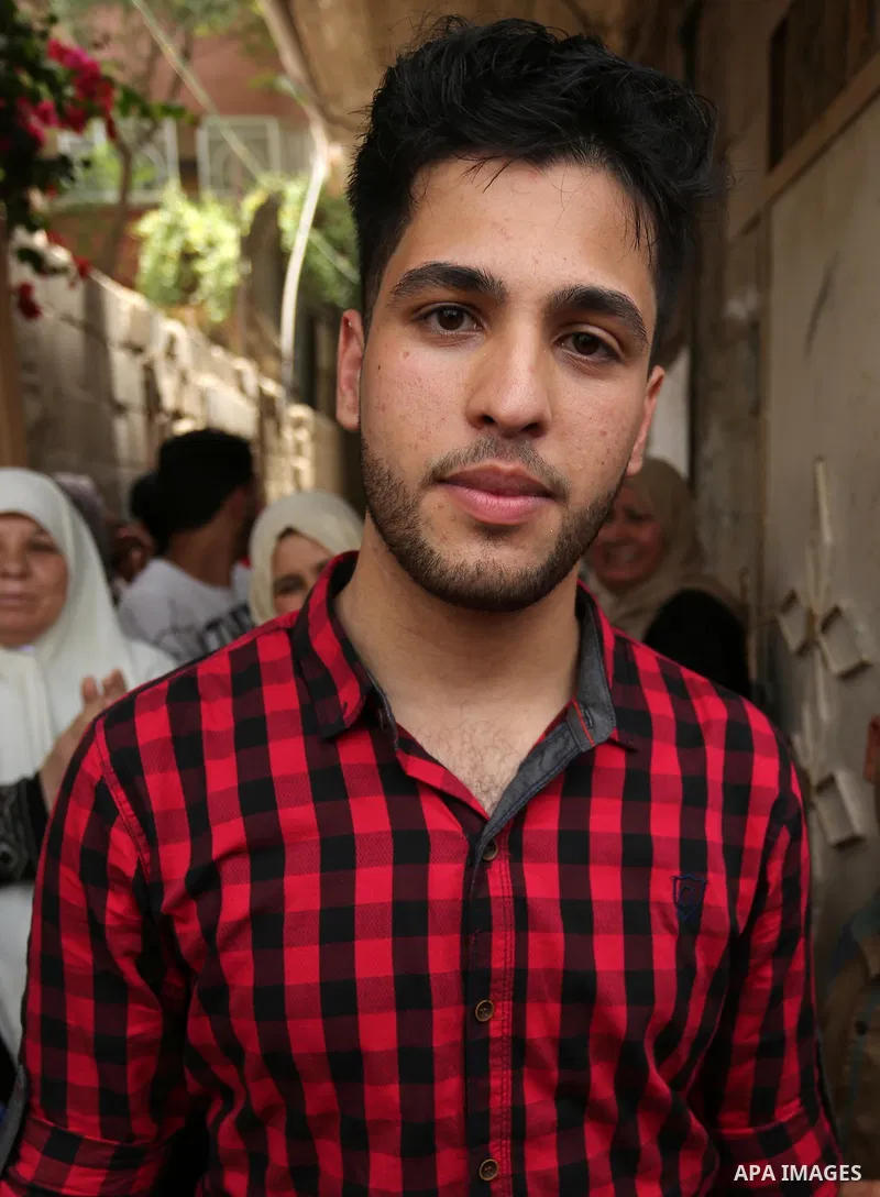 A Palestinian high school student, Loa'y Qnoua 99.7, poses for a photo after heard the results of his final exams known as ''Tawjihi'', in Gaza city on July 12, 2017. Photo by Ashraf Amra