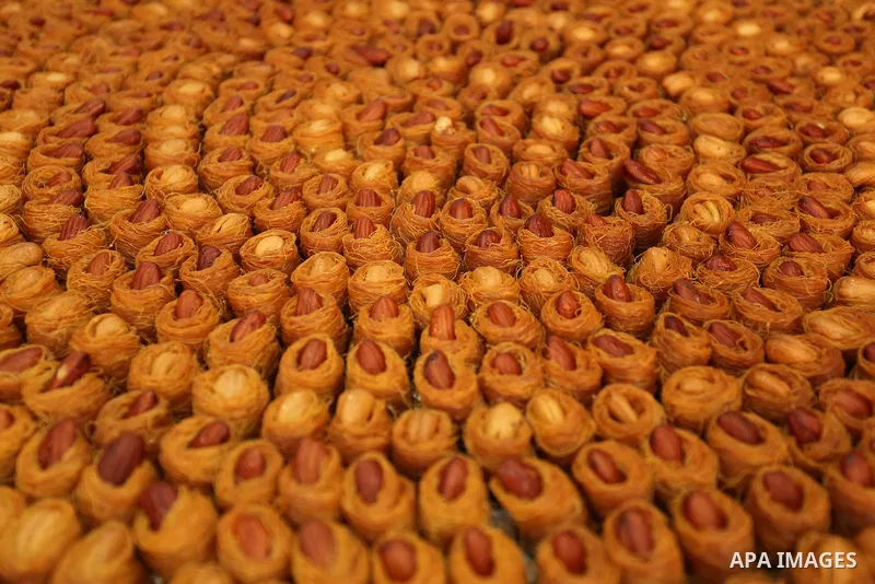 Palestinian vendors sell sweets after the results of high school exams, known as ''Tawjihi'', in Gaza city on July 12, 2017. Photo by Ashraf Amra