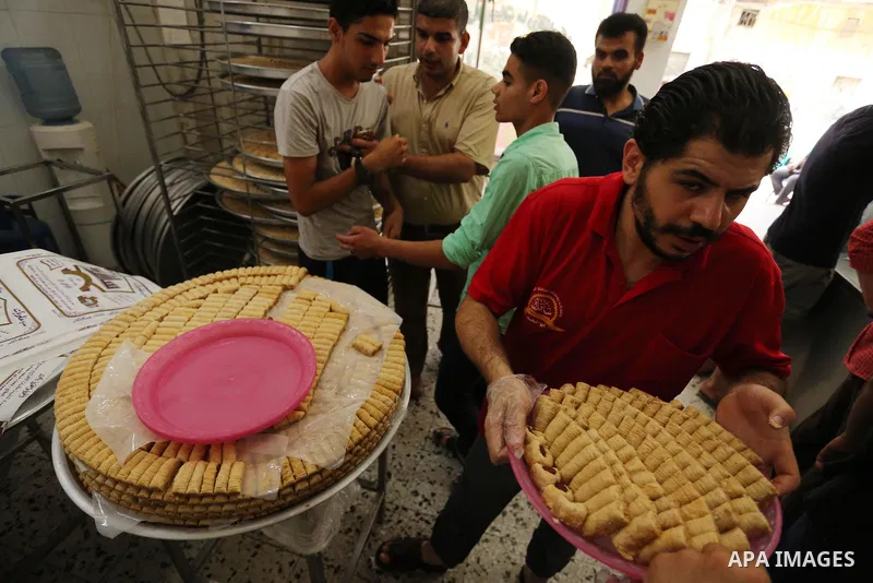 Palestinian vendors sell sweets after the results of high school exams, known as ''Tawjihi'', in Gaza city on July 12, 2017. Photo by Ashraf Amra