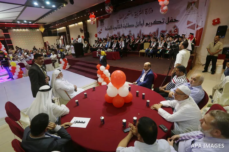 Palestinian top students attend their honoring ceremony after heard the results of their final exams known as ''Tawjihi'' organized by the Ministry of Education, in Gaza city, on July 21, 2017. Photo by Mohammed Asad