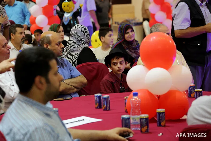 Palestinians attend the honoring ceremony of the top of high school students known as ''Tawjihi'' organized by the Ministry of Education, in Gaza city, on July 21, 2017. Photo by Mohammed Asad