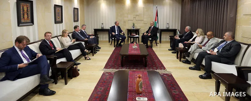 Palestinian Prime Minister Rami Hamdallah meets with Ireland's Minister of Foreign Affairs, Simon Coveney, at his office in the West Bank city of Ramallah on July 13, 2017. Photo by Prime Minister Office