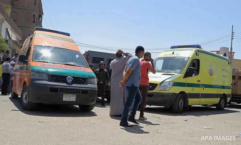 Egyptian policemen inspect the scene of an attack which left five of their colleagues killed in a shooting near Badrasheen, a town some 20 kilometres (12 miles) from Cairo where militants have also targeted security forc...