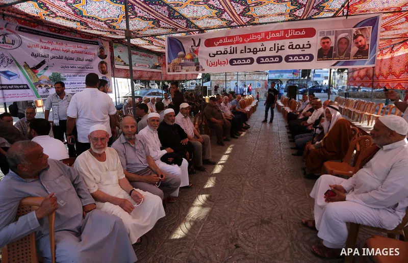 Palestinians offer condolences in Martyrs of Al Aqsa in Gaza City on July 15, 2017. Photo by Mohammed Asad