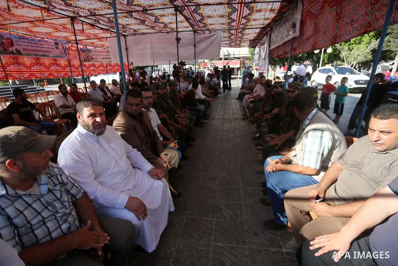 Palestinians offer condolences in Martyrs of Al Aqsa in Gaza City on July 15, 2017. Photo by Mohammed Asad