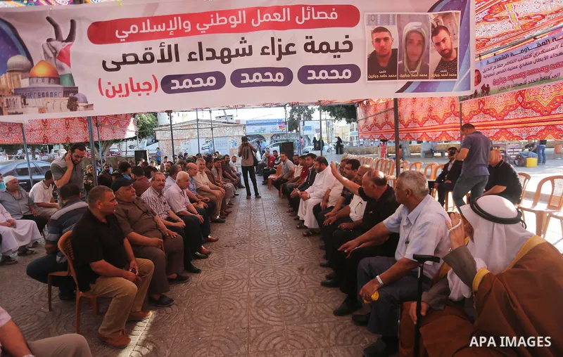 Palestinians offer condolences in Martyrs of Al Aqsa in Gaza City on July 15, 2017. Photo by Mohammed Asad