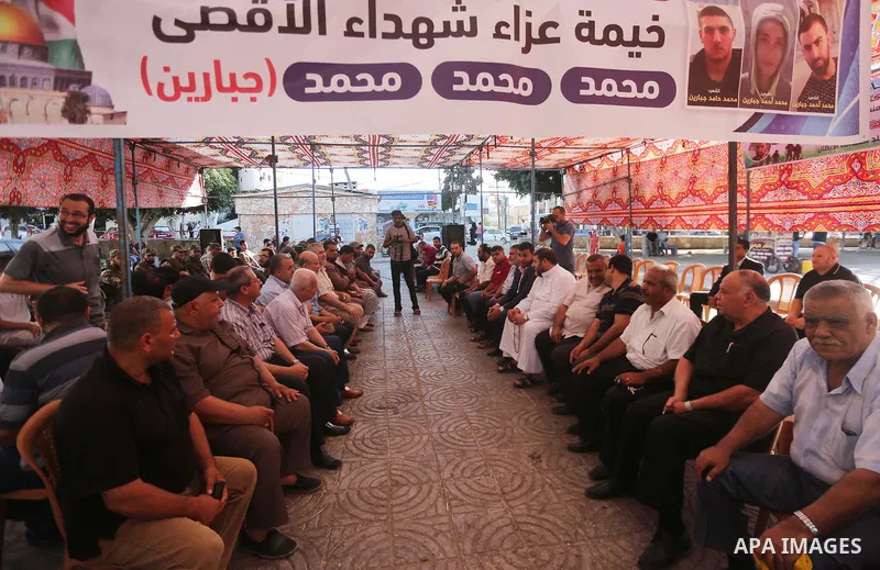 Palestinians offer condolences in Martyrs of Al Aqsa in Gaza City on July 15, 2017. Photo by Mohammed Asad