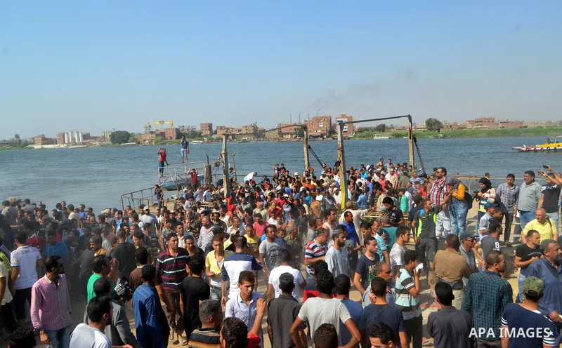 Egyptians gather during the operations of removal of illegal buildings which built on the state lands in the Warraq district of Giza, southwest of Cairo, Egypt, on July 16, 2017. Photo by Amr Sayed