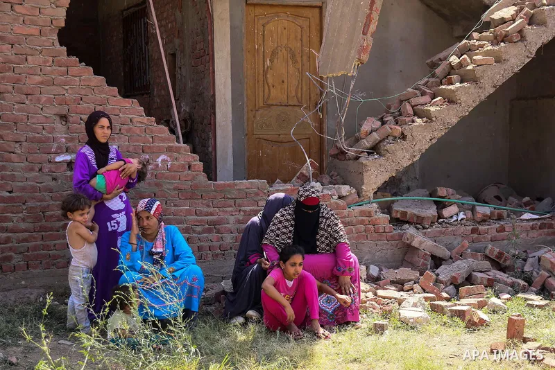 Egyptians look during the operations of removal of illegal buildings which built on the state lands in the Warraq district of Giza, southwest of Cairo, Egypt, on July 16, 2017. Photo by Amr Sayed