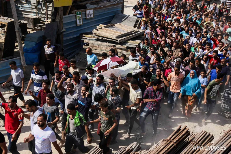 Egyptians carry the body of Sayed Tafshan, who died during clashes between Egyptians security forces and residents in the Warraq district of Giza, southwest of Cairo, Egypt, on July 16, 2017. Egypt's Health Ministry said...