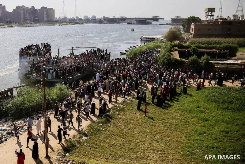 Egyptians gather during the operations of removal of illegal buildings which built on the state lands in the Warraq district of Giza, southwest of Cairo, Egypt, on July 16, 2017. Photo by Amr Sayed