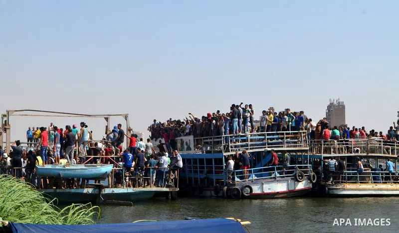 Egyptians gather during the operations of removal of illegal buildings which built on the state lands in the Warraq district of Giza, southwest of Cairo, Egypt, on July 16, 2017. Photo by Amr Sayed