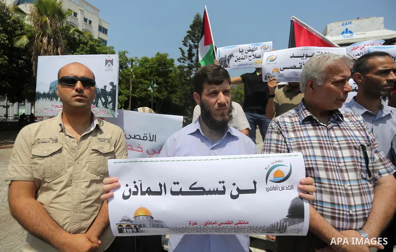 Palestinians take part in a protest against the recent closure of the Al-Aqsa Mosque compound by Israel, in Gaza City on July 17, 2017. Photo by Mohammed Asad