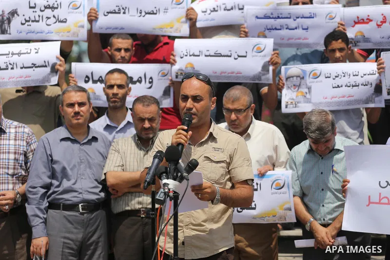 Palestinians take part in a protest against the recent closure of the Al-Aqsa Mosque compound by Israel, in Gaza City on July 17, 2017. Photo by Mohammed Asad