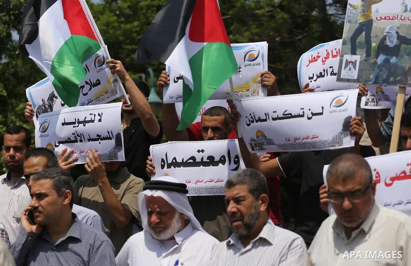 Palestinians take part in a protest against the recent closure of the Al-Aqsa Mosque compound by Israel, in Gaza City on July 17, 2017. Photo by Mohammed Asad