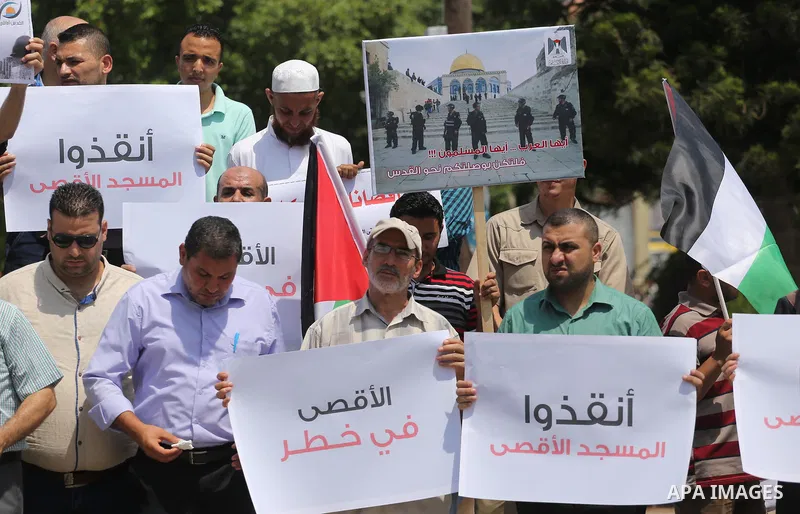Palestinians take part in a protest against the recent closure of the Al-Aqsa Mosque compound by Israel, in Gaza City on July 17, 2017. Photo by Mohammed Asad