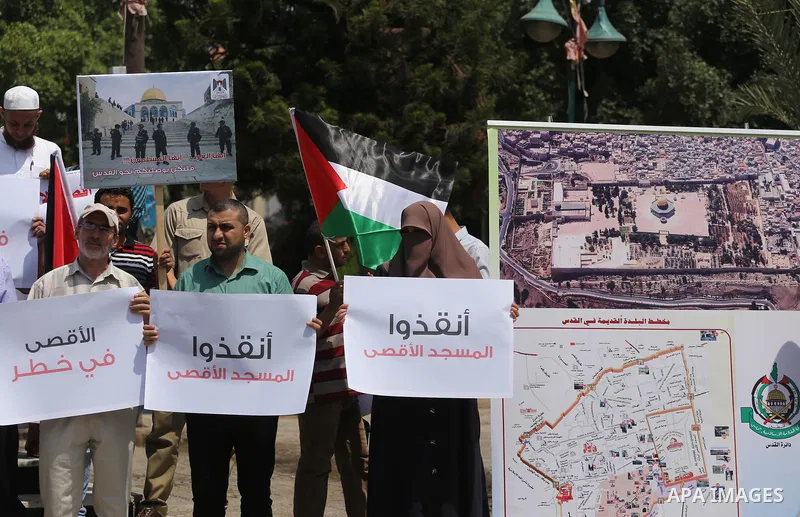 Palestinians take part in a protest against the recent closure of the Al-Aqsa Mosque compound by Israel, in Gaza City on July 17, 2017. Photo by Mohammed Asad