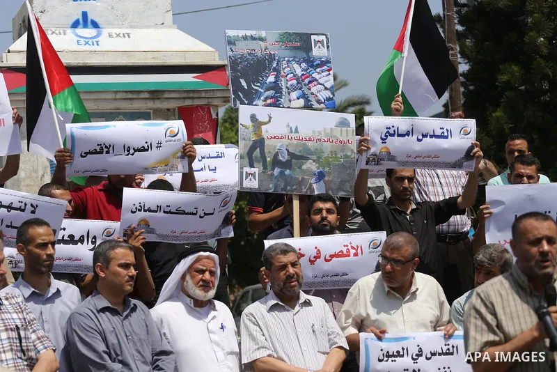 Palestinians take part in a protest against the recent closure of the Al-Aqsa Mosque compound by Israel, in Gaza City on July 17, 2017. Photo by Mohammed Asad