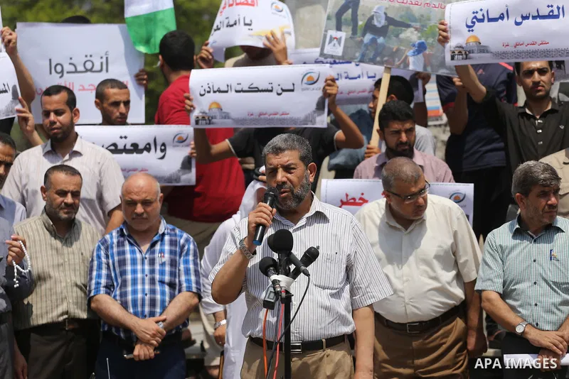 Palestinians take part in a protest against the recent closure of the Al-Aqsa Mosque compound by Israel, in Gaza City on July 17, 2017. Photo by Mohammed Asad