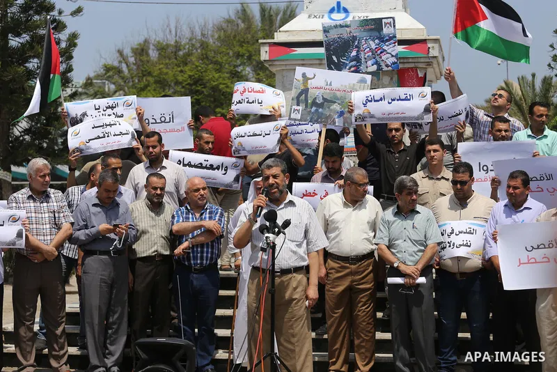 Palestinians take part in a protest against the recent closure of the Al-Aqsa Mosque compound by Israel, in Gaza City on July 17, 2017. Photo by Mohammed Asad