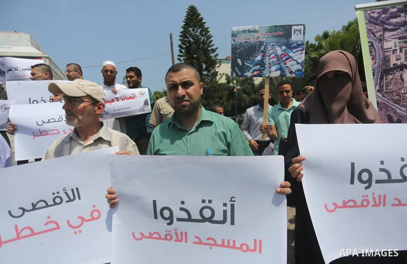 Palestinians take part in a protest against the recent closure of the Al-Aqsa Mosque compound by Israel, in Gaza City on July 17, 2017. Photo by Mohammed Asad