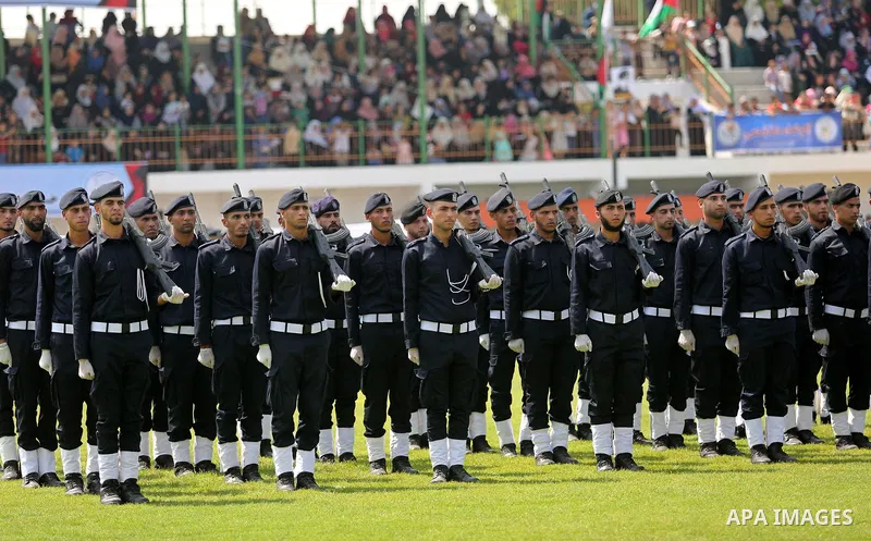 Palestinian policemen take part in a graduation ceremony, in Gaza City on July 17, 2017. Photo by Ashraf Amra