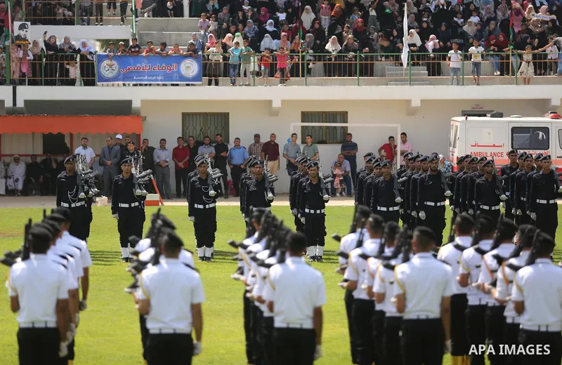 Palestinian policemen take part in a graduation ceremony, in Gaza City on July 17, 2017. Photo by Ashraf Amra