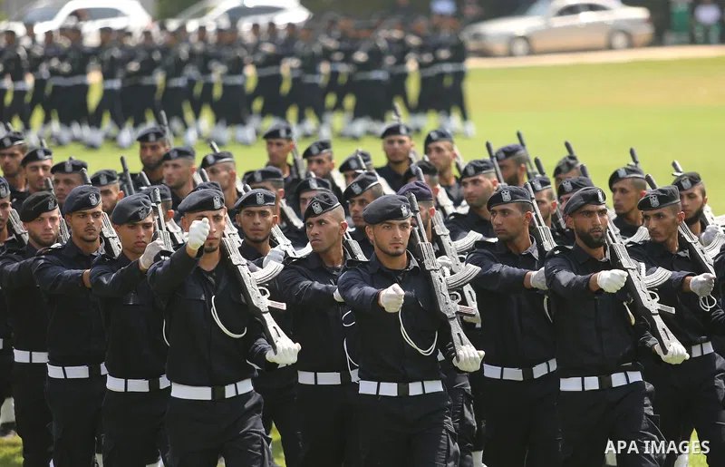 Palestinian policemen take part in a graduation ceremony, in Gaza City on July 17, 2017. Photo by Ashraf Amra