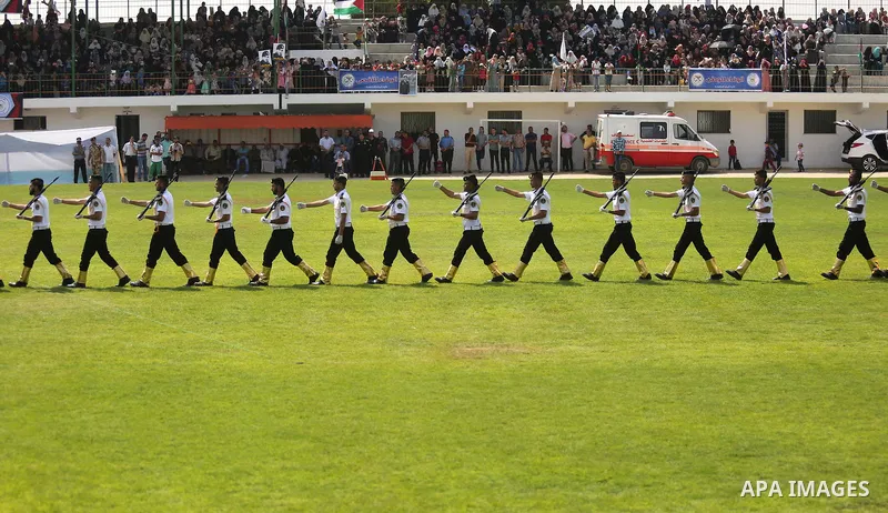Palestinian policemen take part in a graduation ceremony, in Gaza City on July 17, 2017. Photo by Ashraf Amra