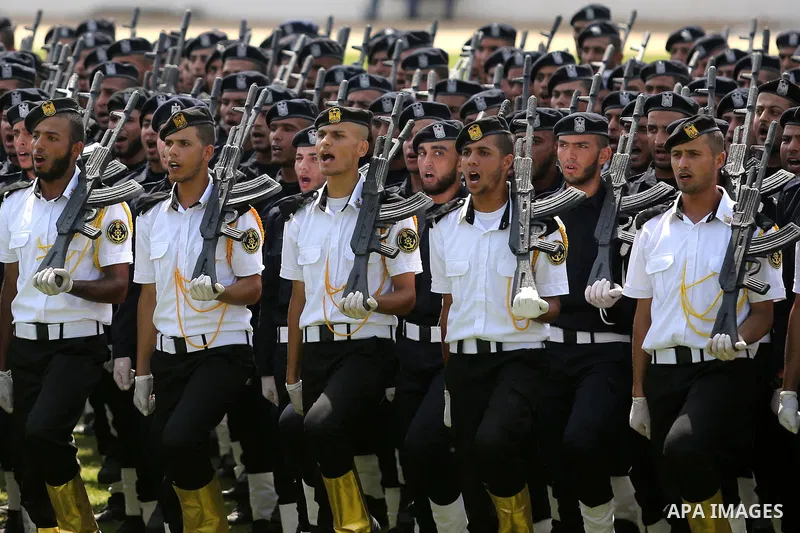 Palestinian policemen take part in a graduation ceremony, in Gaza City on July 17, 2017. Photo by Ashraf Amra