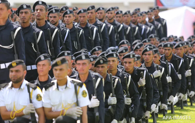 Palestinian policemen take part in a graduation ceremony, in Gaza City on July 17, 2017. Photo by Ashraf Amra