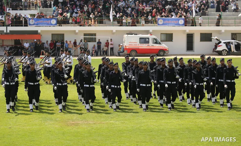 Palestinian policemen take part in a graduation ceremony, in Gaza City on July 17, 2017. Photo by Ashraf Amra