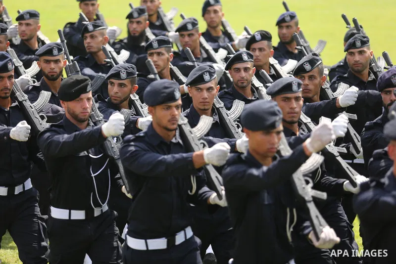 Palestinian policemen take part in a graduation ceremony, in Gaza City on July 17, 2017. Photo by Ashraf Amra