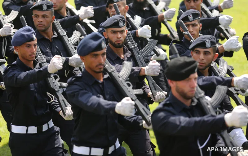 Palestinian policemen take part in a graduation ceremony, in Gaza City on July 17, 2017. Photo by Ashraf Amra