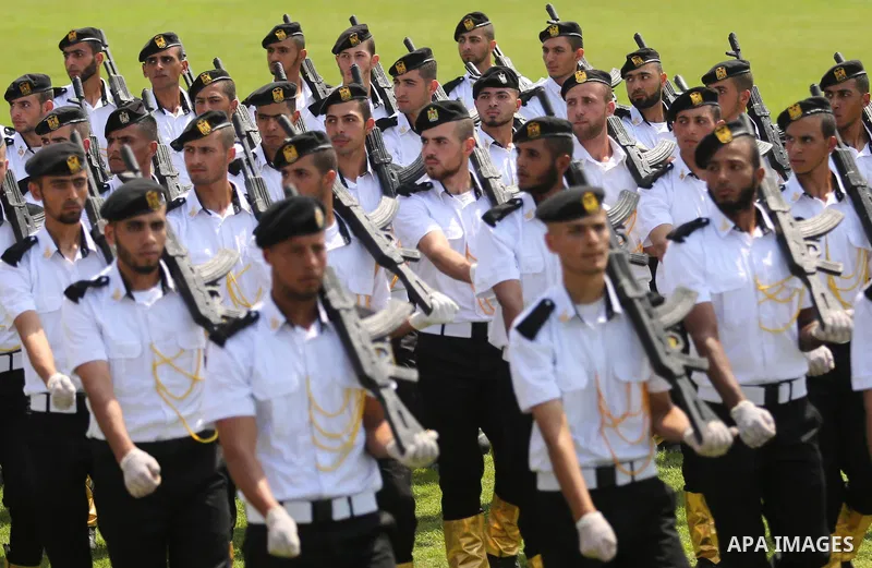 Palestinian policemen take part in a graduation ceremony, in Gaza City on July 17, 2017. Photo by Ashraf Amra