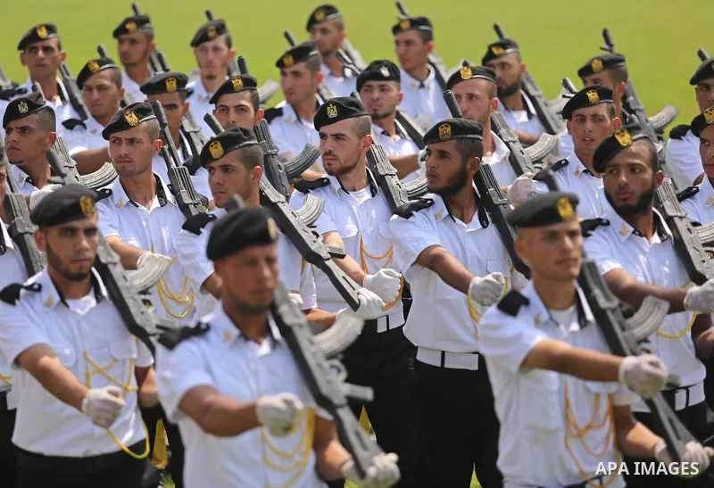 Palestinian policemen take part in a graduation ceremony, in Gaza City on July 17, 2017. Photo by Ashraf Amra