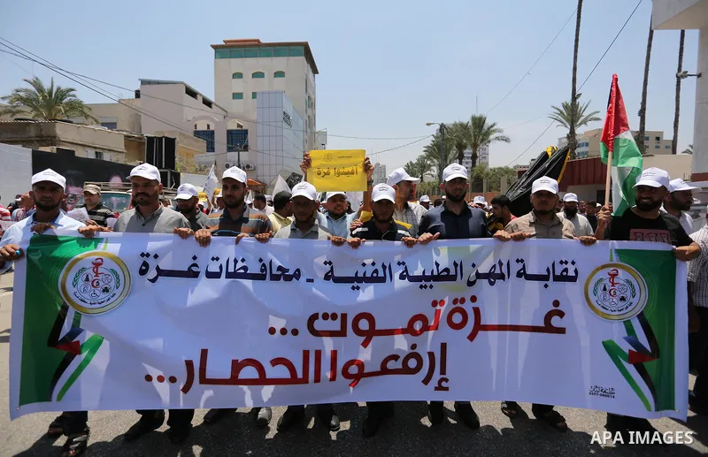 Palestinians take part in a protest against the recent closure of the Al-Aqsa Mosque compound by Israel and Israeli blockade on Gaza strip, in Gaza City on July 18, 2017. Photo by Ashraf Amra
