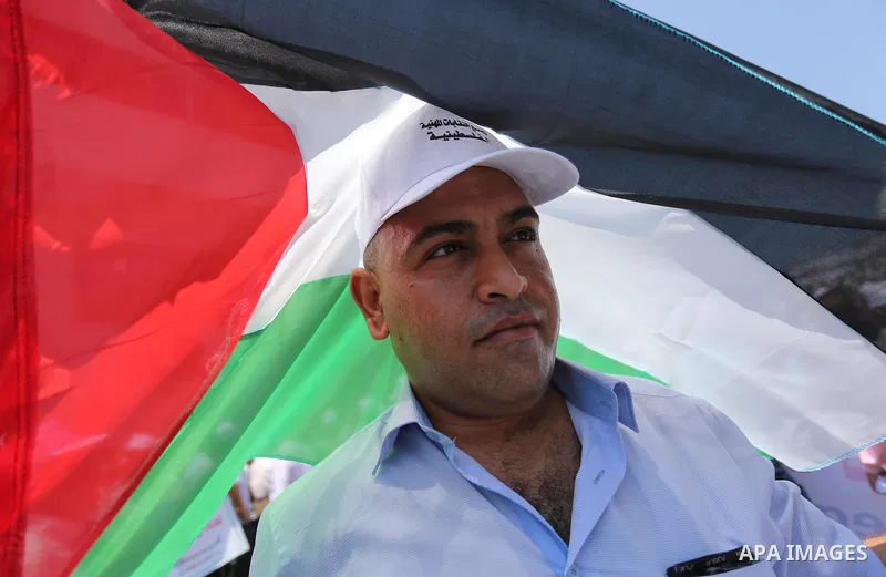 Palestinians take part in a protest against the recent closure of the Al-Aqsa Mosque compound by Israel and Israeli blockade on Gaza strip, in Gaza City on July 18, 2017. Photo by Ashraf Amra