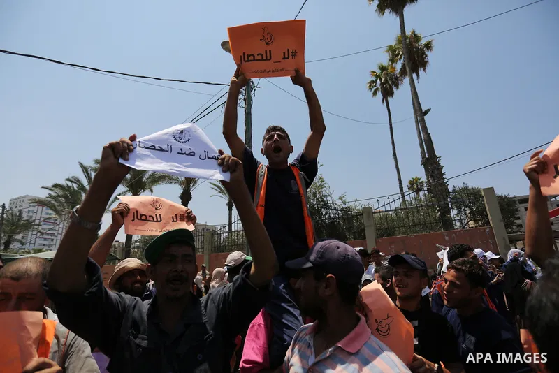 Palestinians take part in a protest against the recent closure of the Al-Aqsa Mosque compound by Israel and Israeli blockade on Gaza strip, in Gaza City on July 18, 2017. Photo by Ashraf Amra