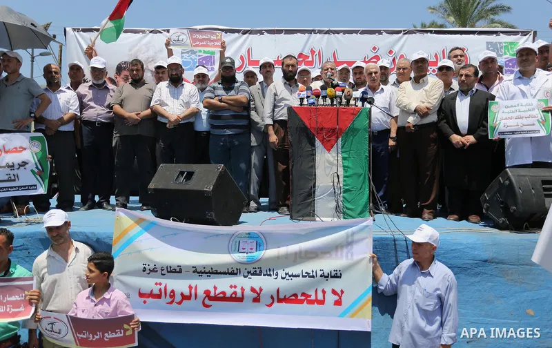 Palestinians take part in a protest against the recent closure of the Al-Aqsa Mosque compound by Israel and Israeli blockade on Gaza strip, in Gaza City on July 18, 2017. Photo by Ashraf Amra