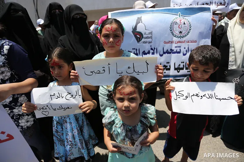 Palestinians take part in a protest against the recent closure of the Al-Aqsa Mosque compound by Israel and Israeli blockade on Gaza strip, in Gaza City on July 18, 2017. Photo by Ashraf Amra