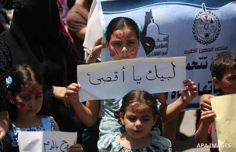 Palestinians take part in a protest against the recent closure of the Al-Aqsa Mosque compound by Israel and Israeli blockade on Gaza strip, in Gaza City on July 18, 2017. Photo by Ashraf Amra