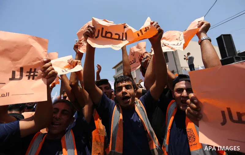 Palestinians take part in a protest against the recent closure of the Al-Aqsa Mosque compound by Israel and Israeli blockade on Gaza strip, in Gaza City on July 18, 2017. Photo by Ashraf Amra